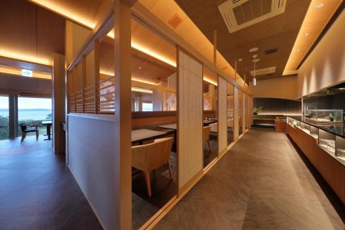 a kitchen and dining room with a table and chairs at Hanashibuki in Tateyama