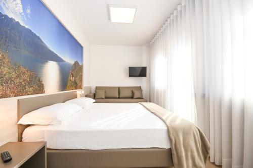 Ένα ή περισσότερα κρεβάτια σε δωμάτιο στο Residence Franca B&B
