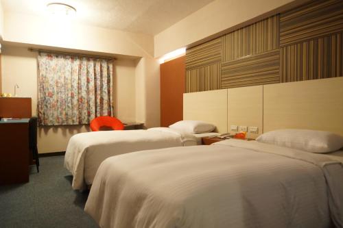 Ліжко або ліжка в номері Ying Dai Hotel