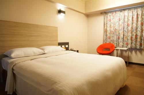 Postel nebo postele na pokoji v ubytování Ying Dai Hotel