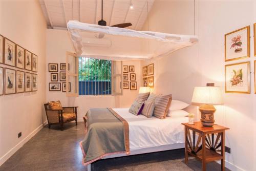 a bedroom with a bed and a window at Monara House, Talpe in Unawatuna