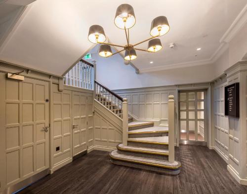 a staircase in a home with a ceiling at Edgbaston Park Hotel Birmingham in Birmingham