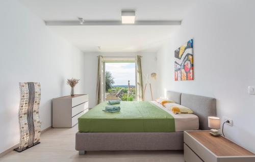 a bedroom with a bed and a window at Design and Luxury Villa with Pool in Kukci