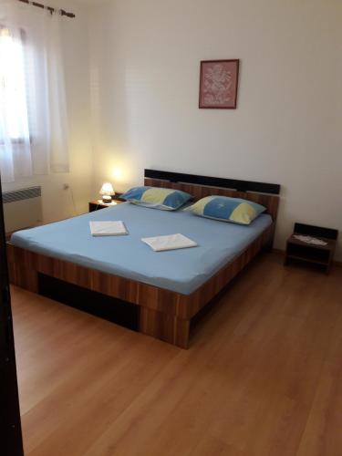 Posteľ alebo postele v izbe v ubytovaní Apartmani Dokoza