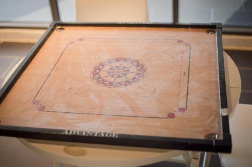 a wooden table with a drawing on it at BSP21 in Jenjarum