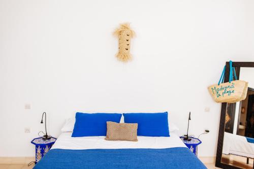 Postel nebo postele na pokoji v ubytování La Maison des Ailleurs