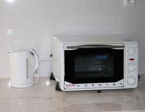 Apartamento Preguiçaにあるキッチンまたは簡易キッチン