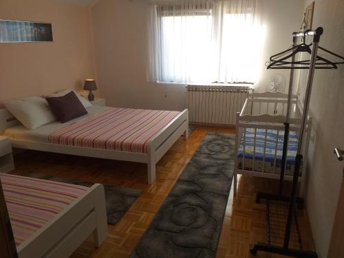 A bed or beds in a room at Apartments Dedic