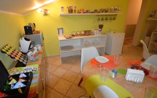 a kitchen with a table and a counter in a room at B&B Portanova in Salerno