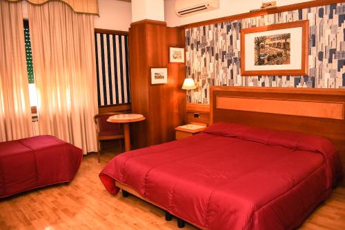Postel nebo postele na pokoji v ubytování Hotel Miravalle