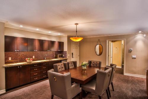 a dining room table and chairs in a room at Tuscany Suites & Casino in Las Vegas