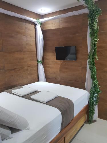 Posteľ alebo postele v izbe v ubytovaní Recanto Convenções