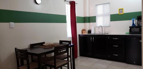 a kitchen with a table and chairs and a sink at Carolina Point Resort in Crown Point