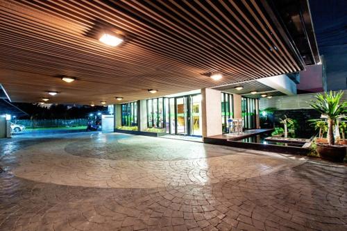 an empty lobby of a building with a large floor at D Day Suite in Bangkok