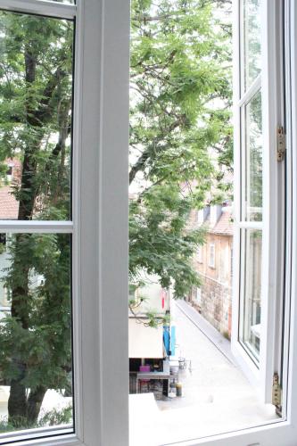 an open window with a view of a street at Rooms Zagreb 17 in Zagreb