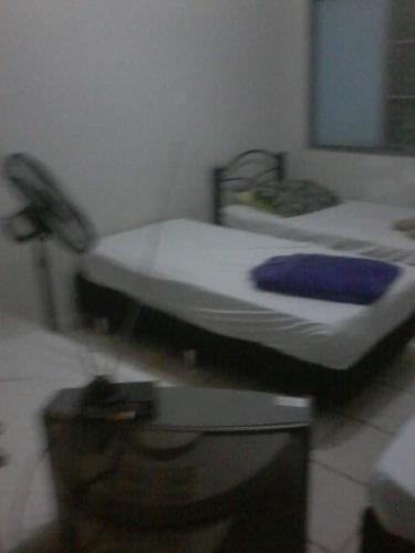 Cama o camas de una habitación en Pousada Vila Tiberio