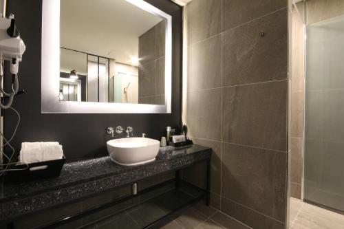 a bathroom with a sink and a mirror at Hotel Eco stay in Jeonju