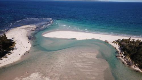 an aerial view of a beach and the ocean at Ocean View Villas in Vincentia