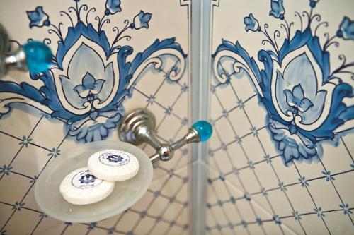 a bathroom mirror with two rolls of toilet paper at Hotel Voce del Mare in Vietri sul Mare