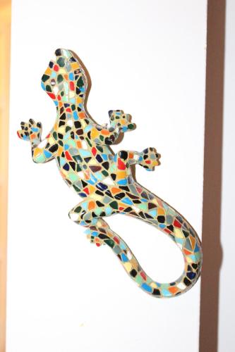 a colorful snake made out of glass on a wall at Rooms Zagreb 17 in Zagreb