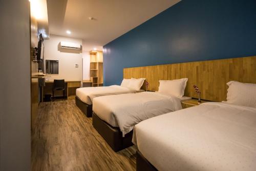 Postel nebo postele na pokoji v ubytování 3-Plus Hotel