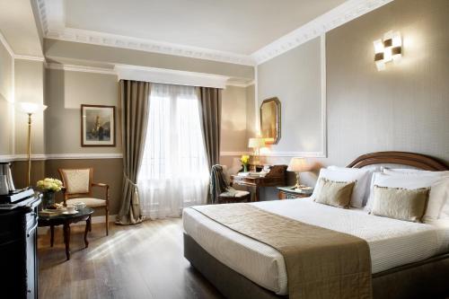Ένα ή περισσότερα κρεβάτια σε δωμάτιο στο Mediterranean Palace