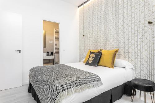 En eller flere senge i et værelse på Waou MALASAÑA es MIA - Corta Duración