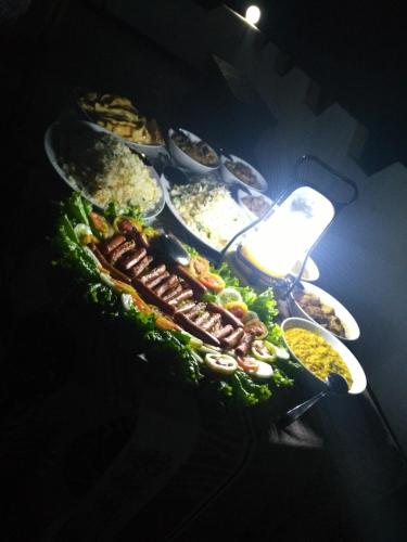 a bunch of different types of food on a table at Viyanga Homestay in Ella