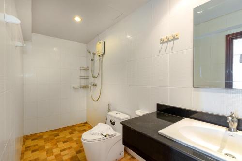 a white bathroom with a sink and a toilet at Patong Hill Estate 6 in Patong Beach