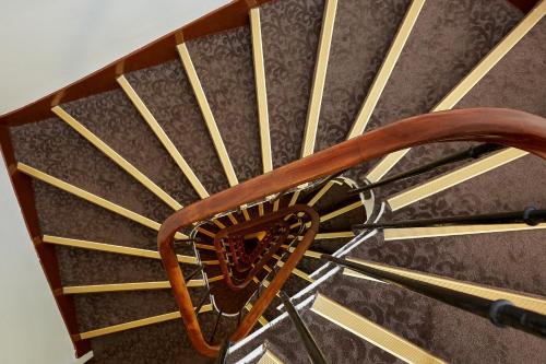 a wooden comb sitting on top of a chair at Austin's Arts Et Metiers Hotel in Paris