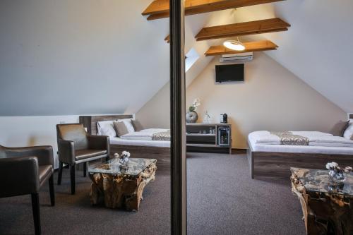 Postel nebo postele na pokoji v ubytování HARDY - Cognac & Pension