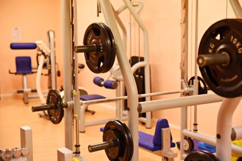 a gym with several rows of tread machines at Hotel Ylläsrinne in Ylläsjärvi