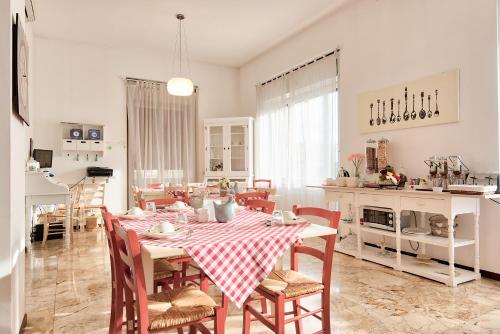 a kitchen and dining room with a table and chairs at Stay Bergamo in Bergamo