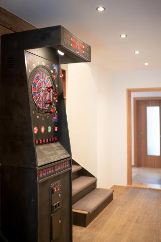 a bowling alley with a dart board on the wall at Stadlchalet in Ried im Oberinntal