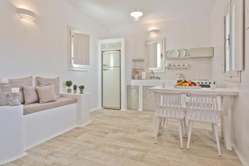 a kitchen and living room with a table and chairs at Lux View Villas in Kyra Panagia