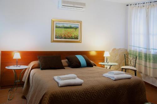Cama o camas de una habitación en Agriturismo I Vigneti