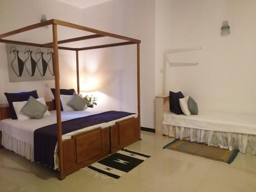 Cosy Nest Home stayにあるベッド