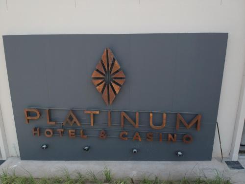 a sign for the palmtum hotel and casino at Platinum Hotel Casino in Villa Ángela