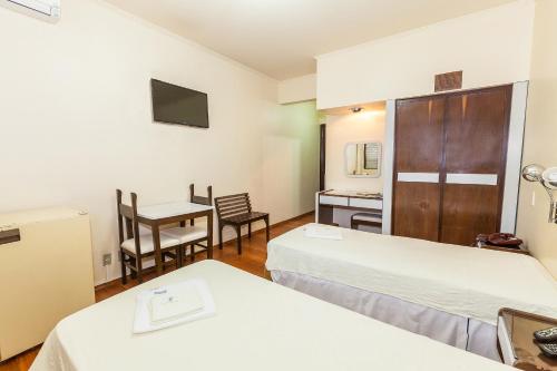 Ένα ή περισσότερα κρεβάτια σε δωμάτιο στο Hotel Letto Caxias
