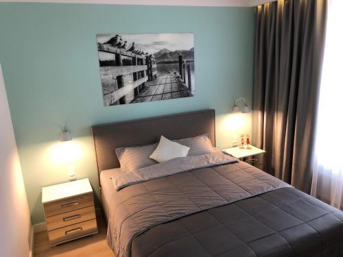 Posteľ alebo postele v izbe v ubytovaní Apartament Turkus