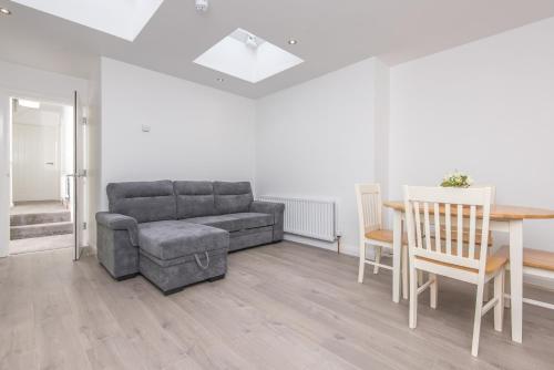 a living room with a couch and a table at The Gem in Armagh