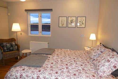 Ένα ή περισσότερα κρεβάτια σε δωμάτιο στο Lax-á Asgardur Cottages