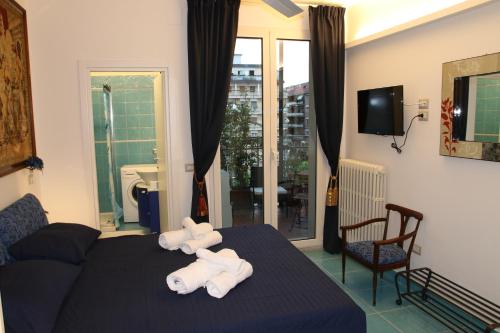 Tempat tidur dalam kamar di L'Arazzo