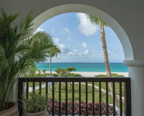 a view of the beach from a balcony at Cap Juluca, A Belmond Hotel, Anguilla in West End Village