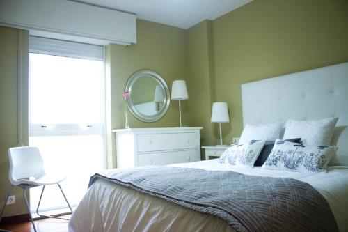 Säng eller sängar i ett rum på Apartamento céntrico y tranquilo en Santiago de Compostela