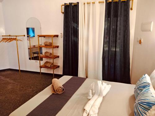 a room with a table with two pairs of gloves at White Chocolate Hills Resort in Zamboanguita