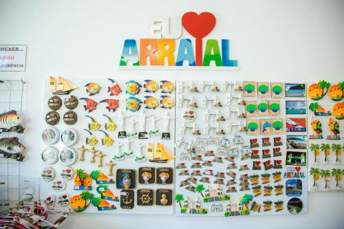 a wall with plates and other items on it at Pousada Belezinha in Arraial do Cabo