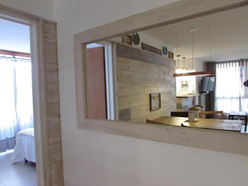 a mirror on a wall in a room at Sweet view del Nahuel in San Carlos de Bariloche