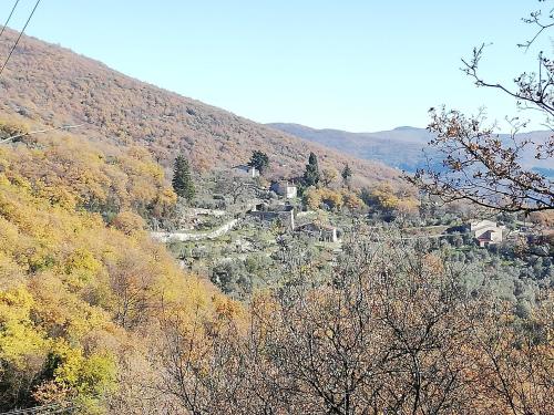 a view of a mountain with a town on a hill at Agriturismo CasaMatta Azienda Agricola in Calenzano