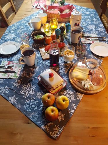 a table with food and drinks on top of it at Uroczysko Skomackie in Stare Juchy